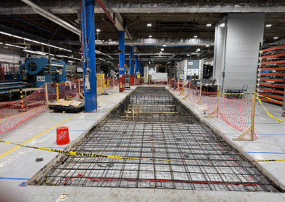 Finished concrete machine foundation for Quintus equipment by Zamora Concrete at Piper Airport