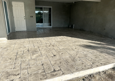 Stamped concrete patio installed by Zamora Concrete with a natural finish