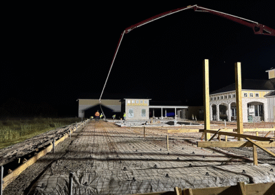 Wide view of custom concrete pool deck installed by Zamora Concrete