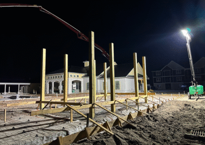 Finished concrete pool deck with outdoor furniture by Zamora Concrete
