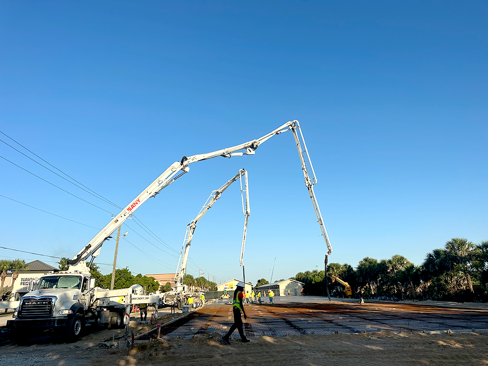Zamora-Concrete-Satellite-Beach Zamora Concrete crew pouring and leveling a new concrete slab at a residential site in Satellite Beach, Florida